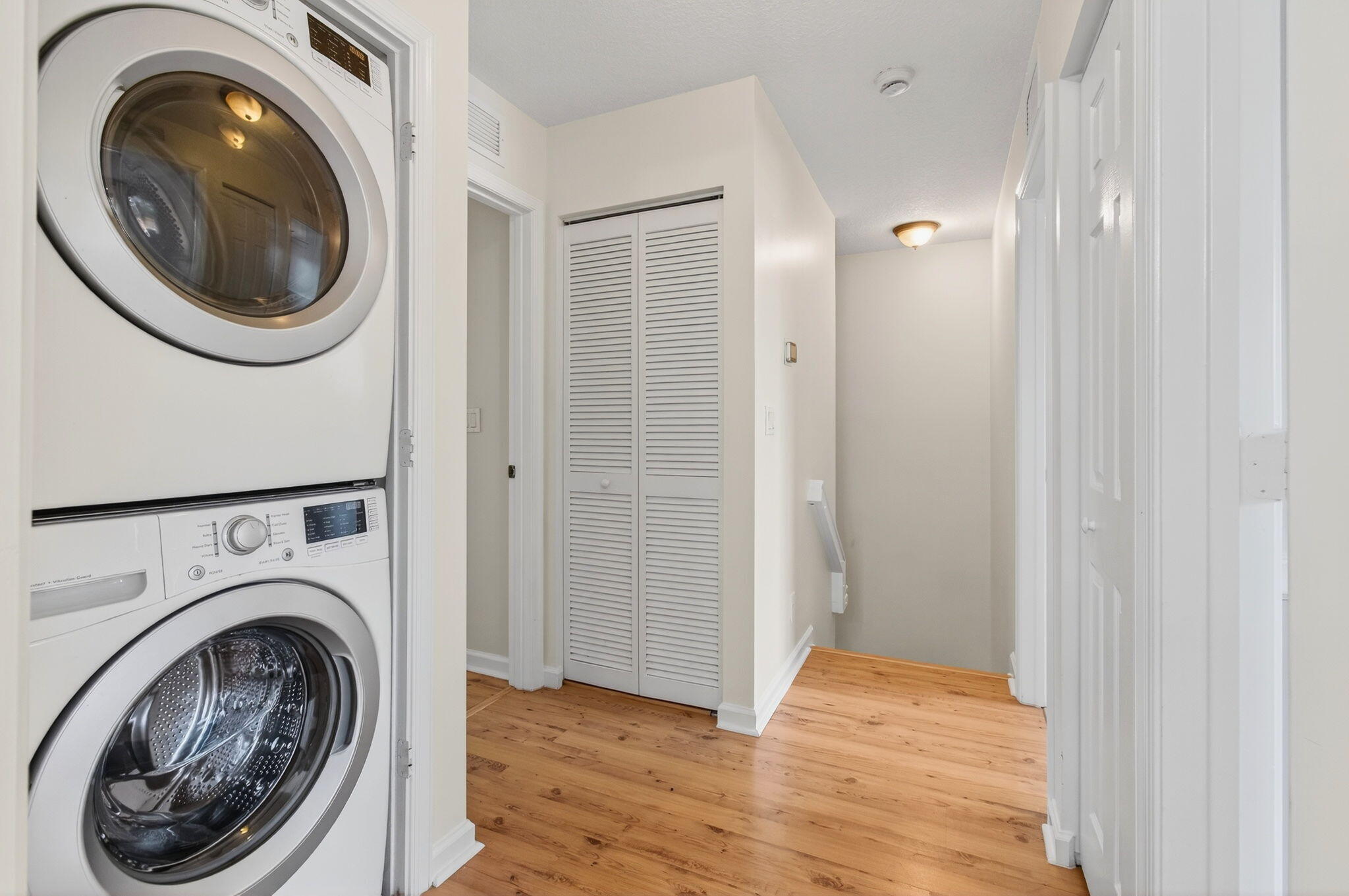 4582 Danson Way Delray Beach, FL 33445 - Photo 31 of 74 a view of a hallway with washer and dryer
