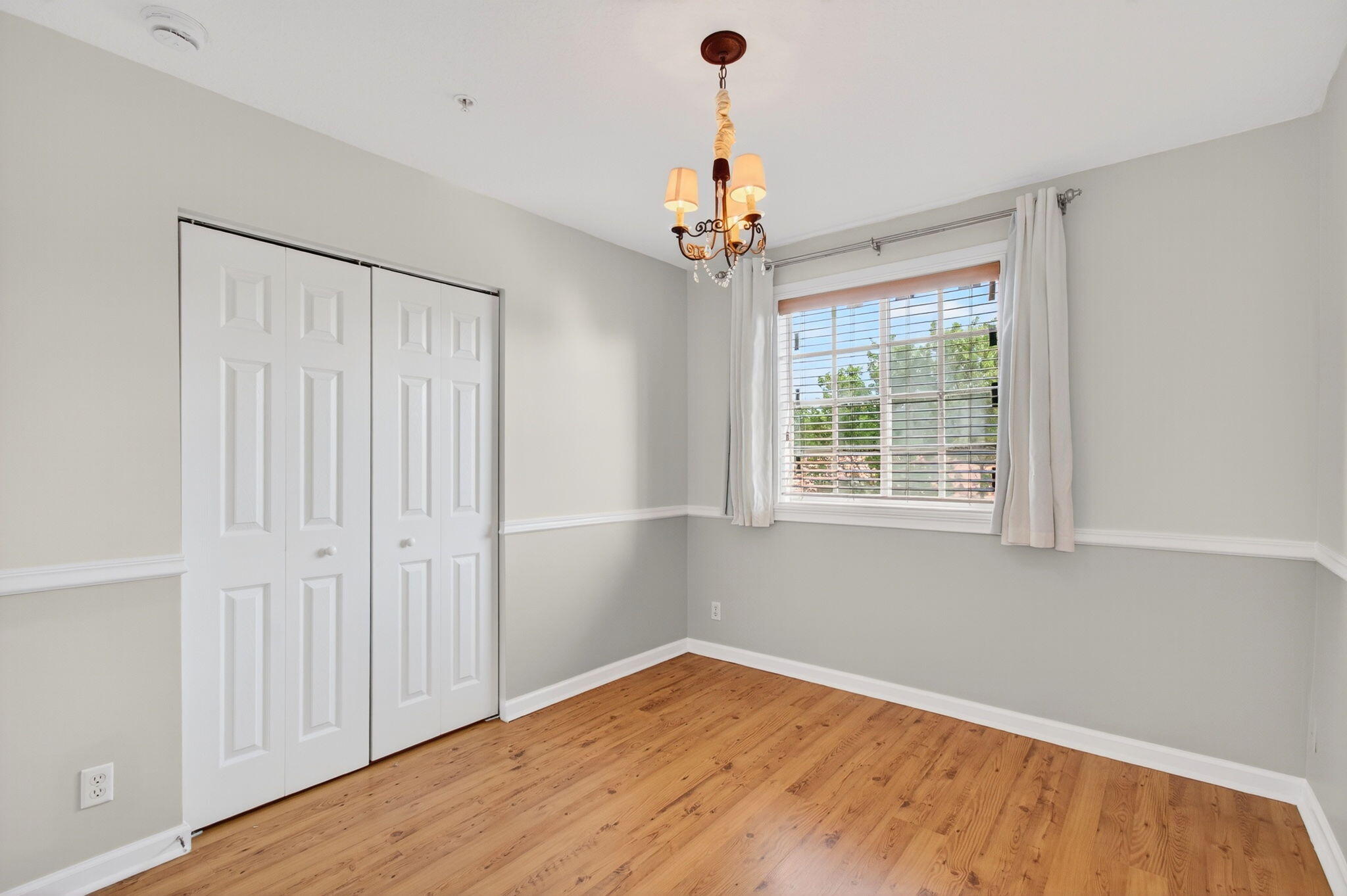 4582 Danson Way Delray Beach, FL 33445 - Photo 40 of 74 a view of an empty room with wooden floor and a window