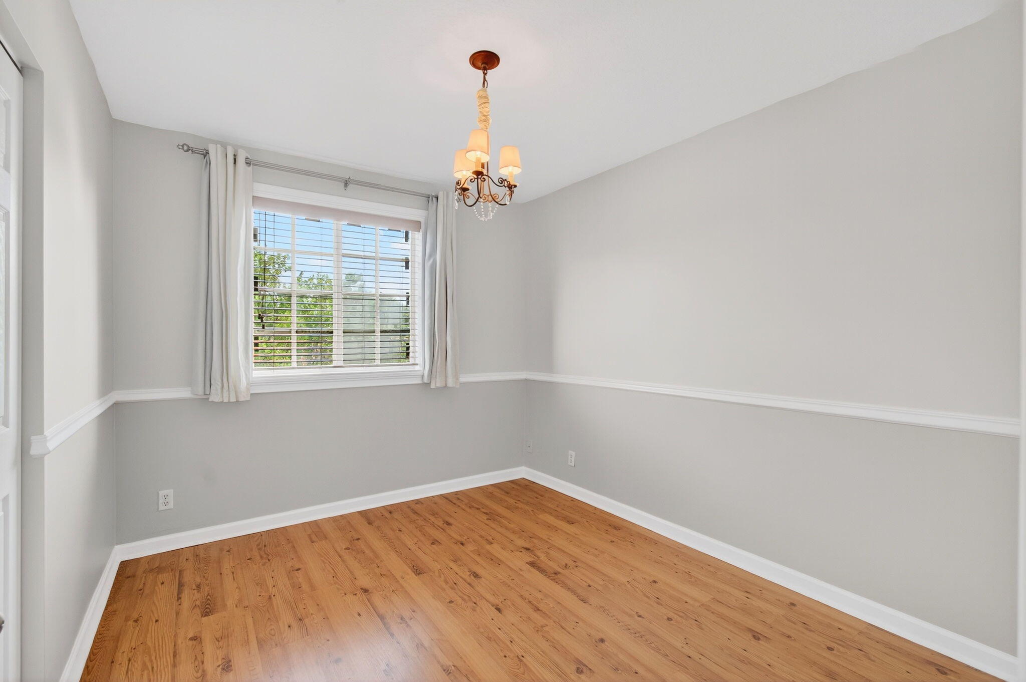 4582 Danson Way Delray Beach, FL 33445 - Photo 43 of 74 wooden floor in an empty room with a window