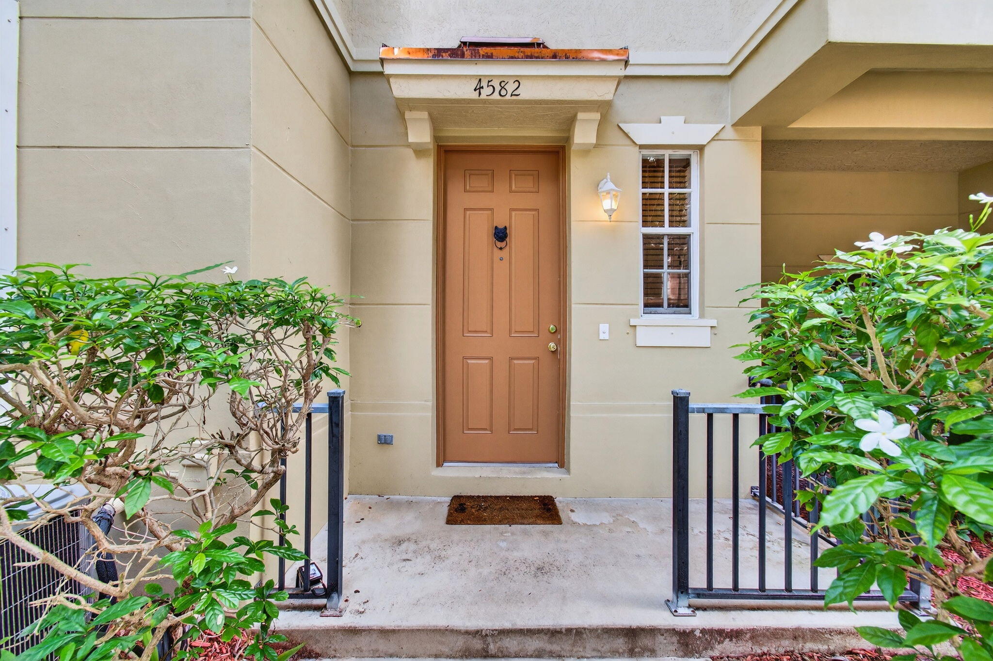 4582 Danson Way Delray Beach, FL 33445 - Photo 48 of 74 a front view of a house with a potted plant