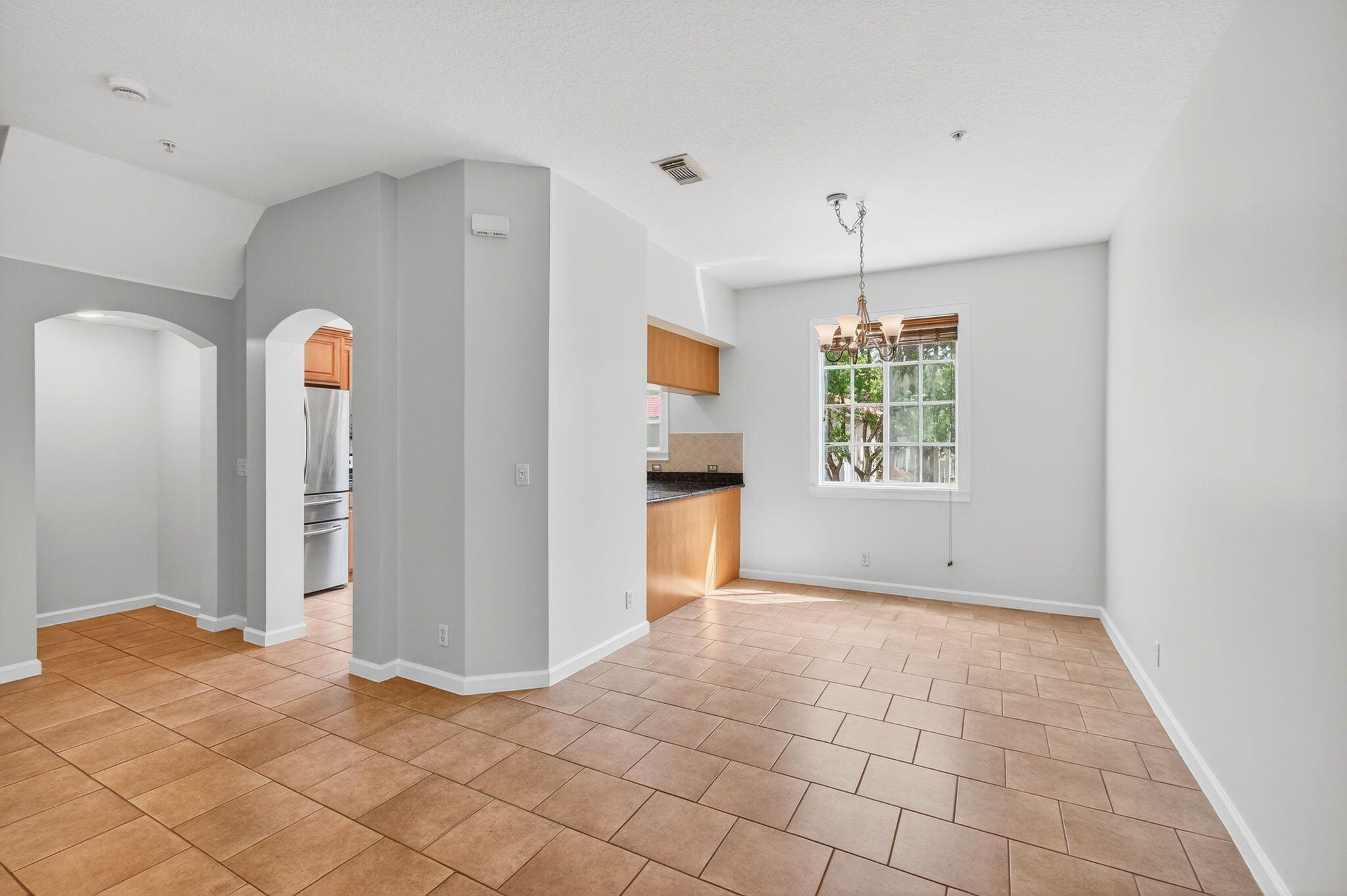 4582 Danson Way Delray Beach, FL 33445 - Photo 10 of 74 a view of an empty room with window and wooden floor