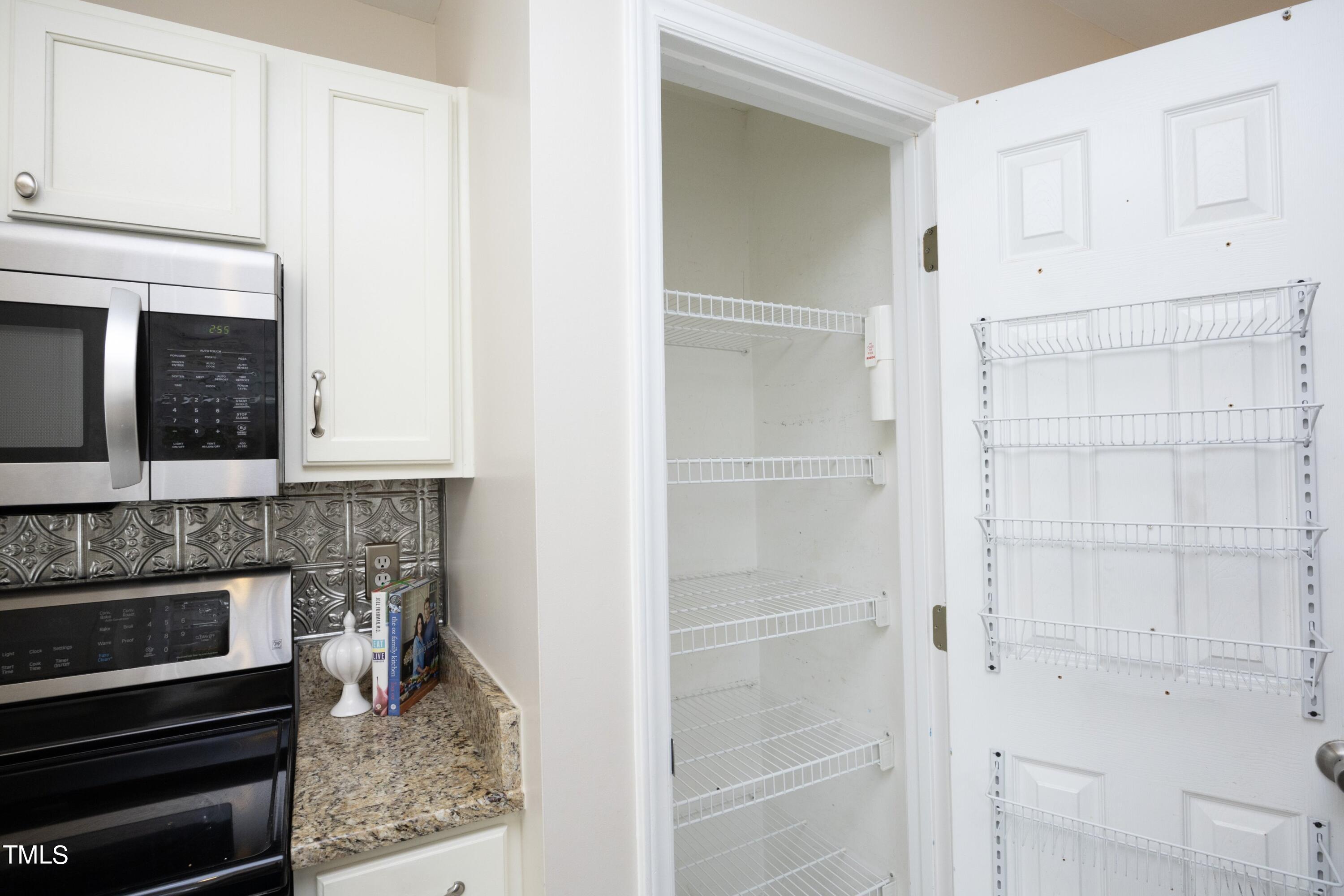 8904 Castleton Lane Raleigh, NC 27615 - Photo 17 of 43 a kitchen with cabinets and appliances