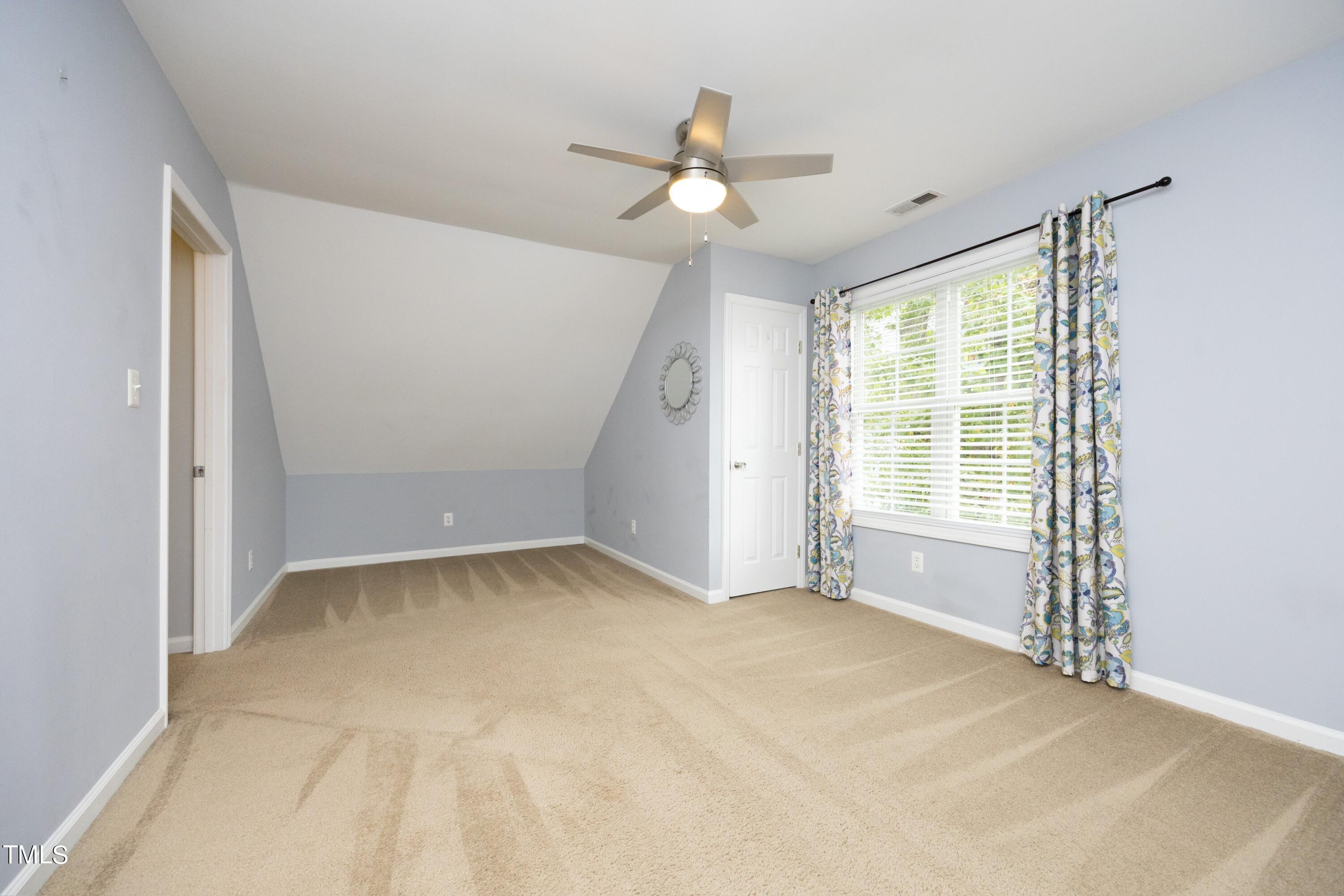 8904 Castleton Lane Raleigh, NC 27615 - Photo 25 of 43 a view of an empty room with a window