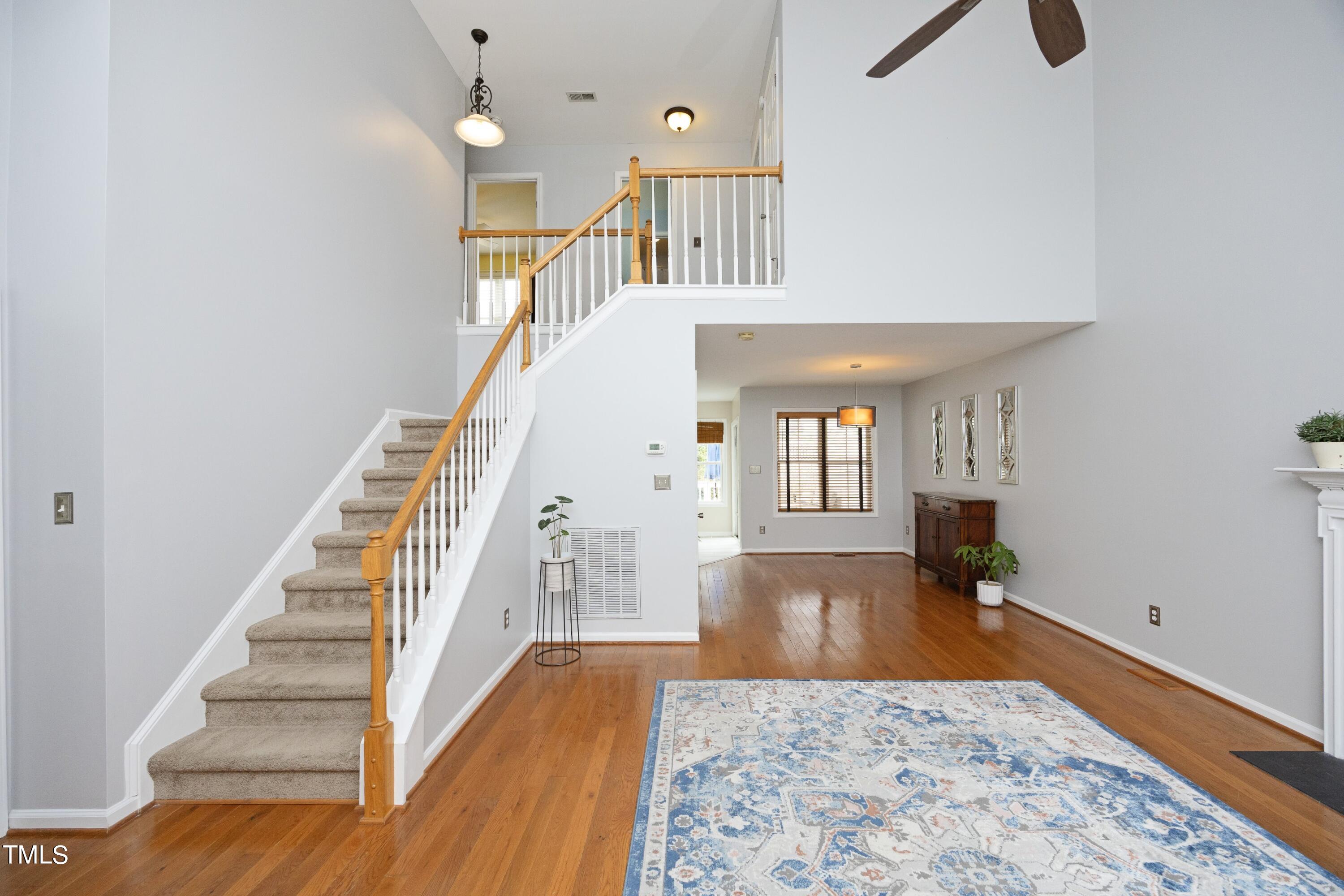 8904 Castleton Lane Raleigh, NC 27615 - Photo 4 of 43 a view of entryway and hall with wooden floor
