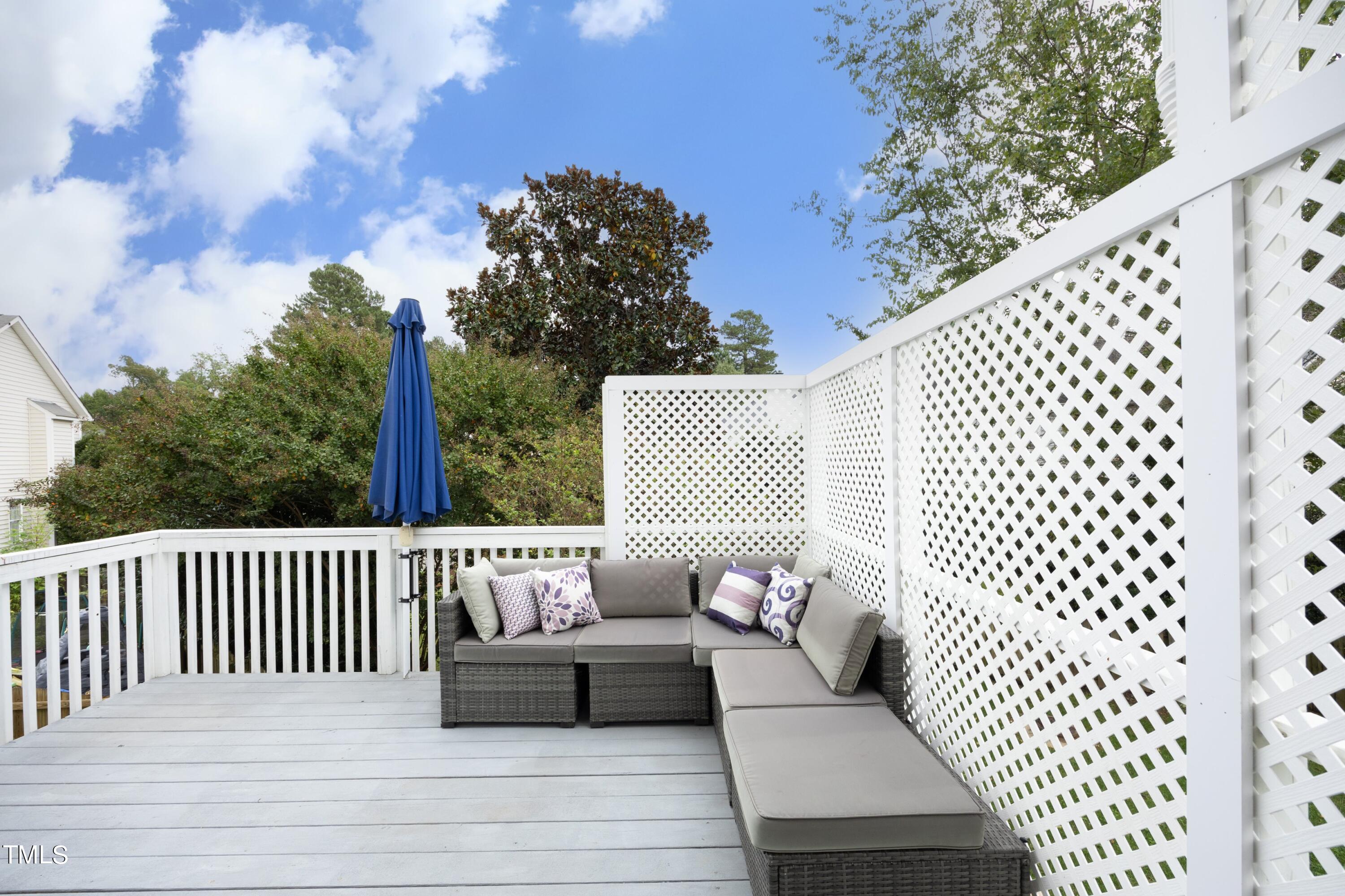8904 Castleton Lane Raleigh, NC 27615 - Photo 5 of 43 a view of a roof deck with wooden floor and fence