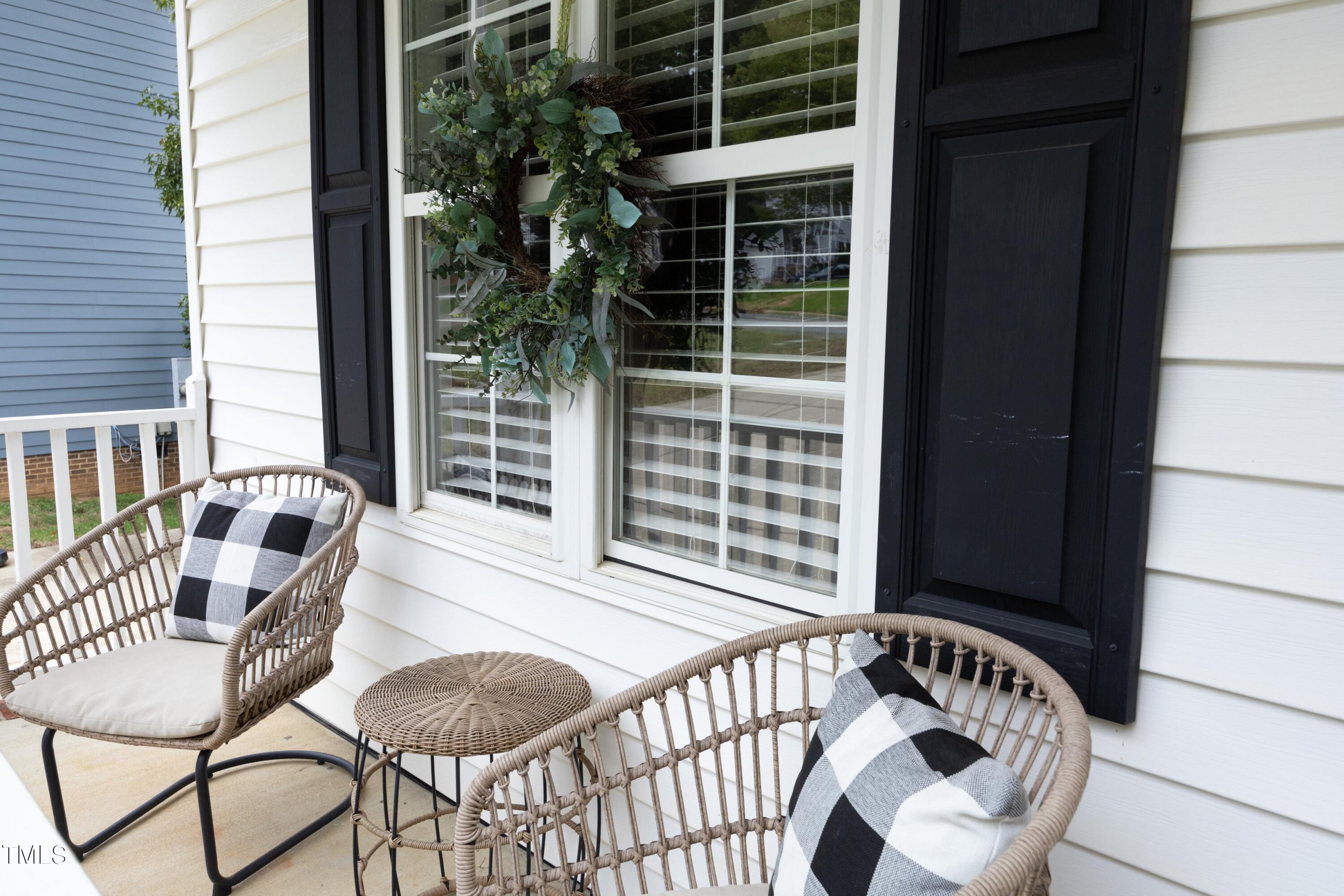 8904 Castleton Lane Raleigh, NC 27615 - Photo 8 of 43 a view of balcony with a potted plant and outdoor seating