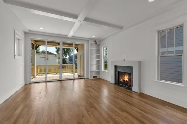 a view of kitchen with a sink and a fireplace