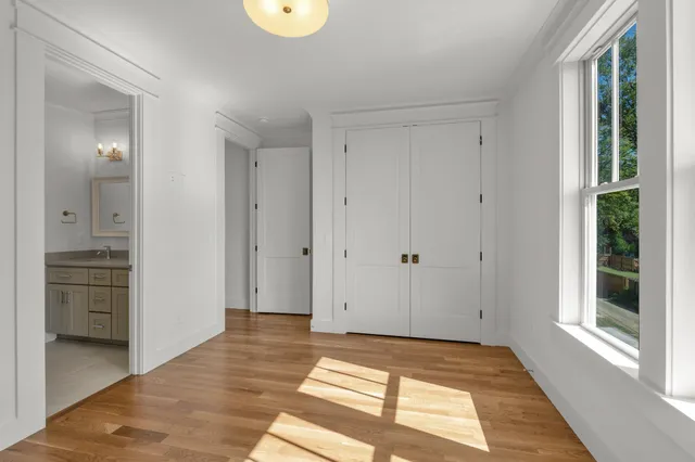 a view of a balcony with wooden floor