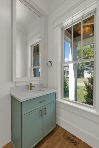 a view of a kitchen with wooden floor and a kitchen