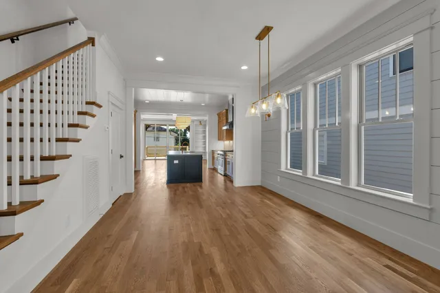 a kitchen with a sink a counter top space and stainless steel appliances