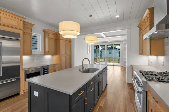 a kitchen with cabinets a sink and a stove