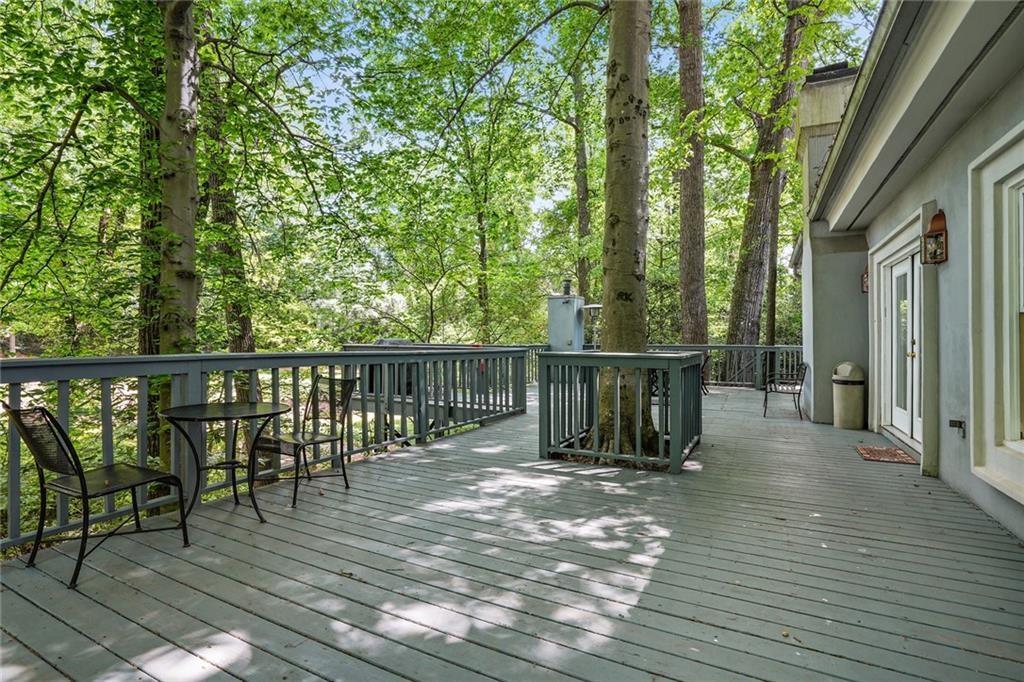 3203 Lenox Road Northeast, Unit 6 Atlanta, GA 30324 - Photo 24 of 27 a view of balcony with wooden floor and fence