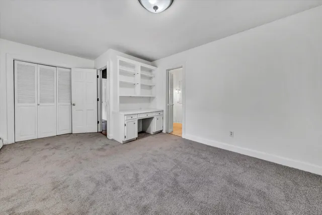 a view of a garage with wooden floor
