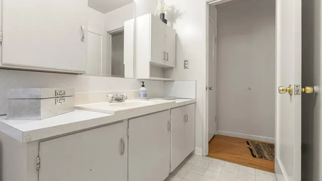 a bathroom with a sink and a mirror
