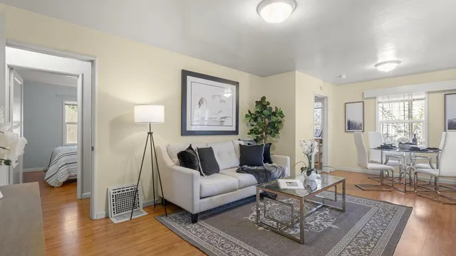 a living room with furniture and a table