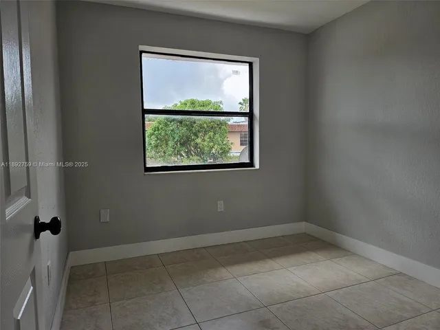 a view of a room that has a window in it