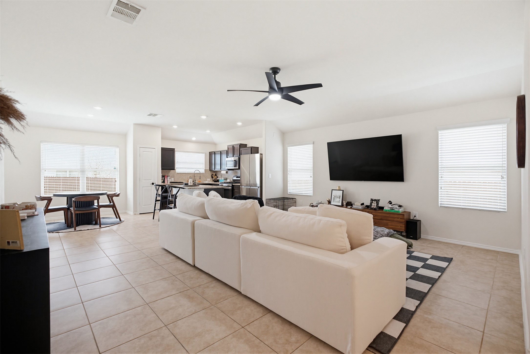 5705 Southerner Way Austin, TX 78747 - Photo 2 of 22 An open concept living area seamlessly connects to the kitchen, perfect for entertaining.