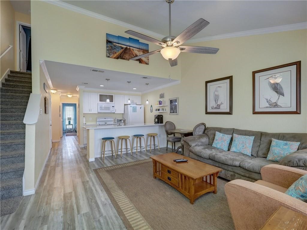 715 Beach Access Road, Unit 1204 Port Aransas, TX 78373 - Photo 11 of 33 a living room with furniture and a table