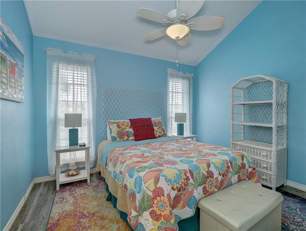 715 Beach Access Road, Unit 1204 Port Aransas, TX 78373 - Photo 24 of 33 a bedroom with a bed and a window
