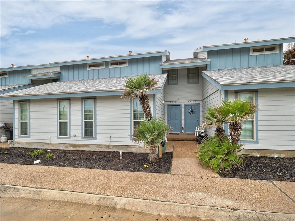 715 Beach Access Road, Unit 1204 Port Aransas, TX 78373 - Photo 31 of 33 a front view of a house with garden