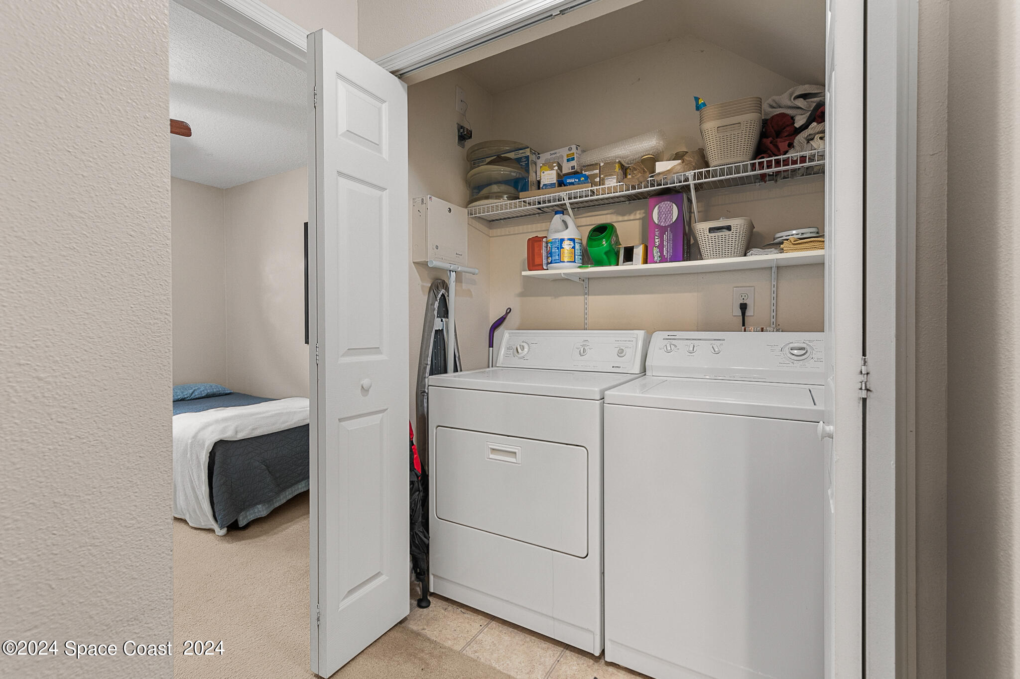 890 Luminary Circle, Unit 103 Melbourne, FL 32901 - Photo 15 of 32 a utility room with dryer and washer