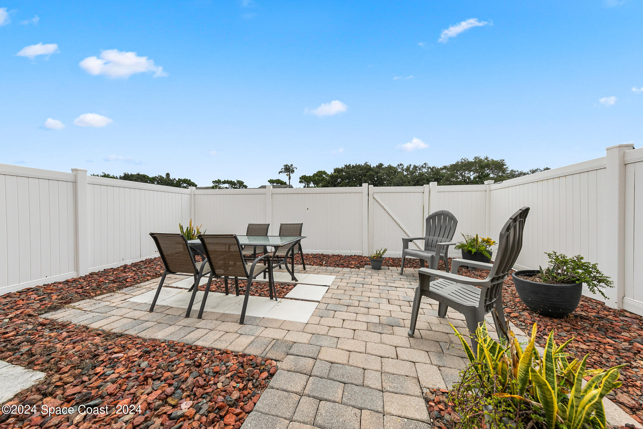 890 Luminary Circle, Unit 103 Melbourne, FL 32901 - Photo 21 of 32 a view of a terrace with furniture and stove