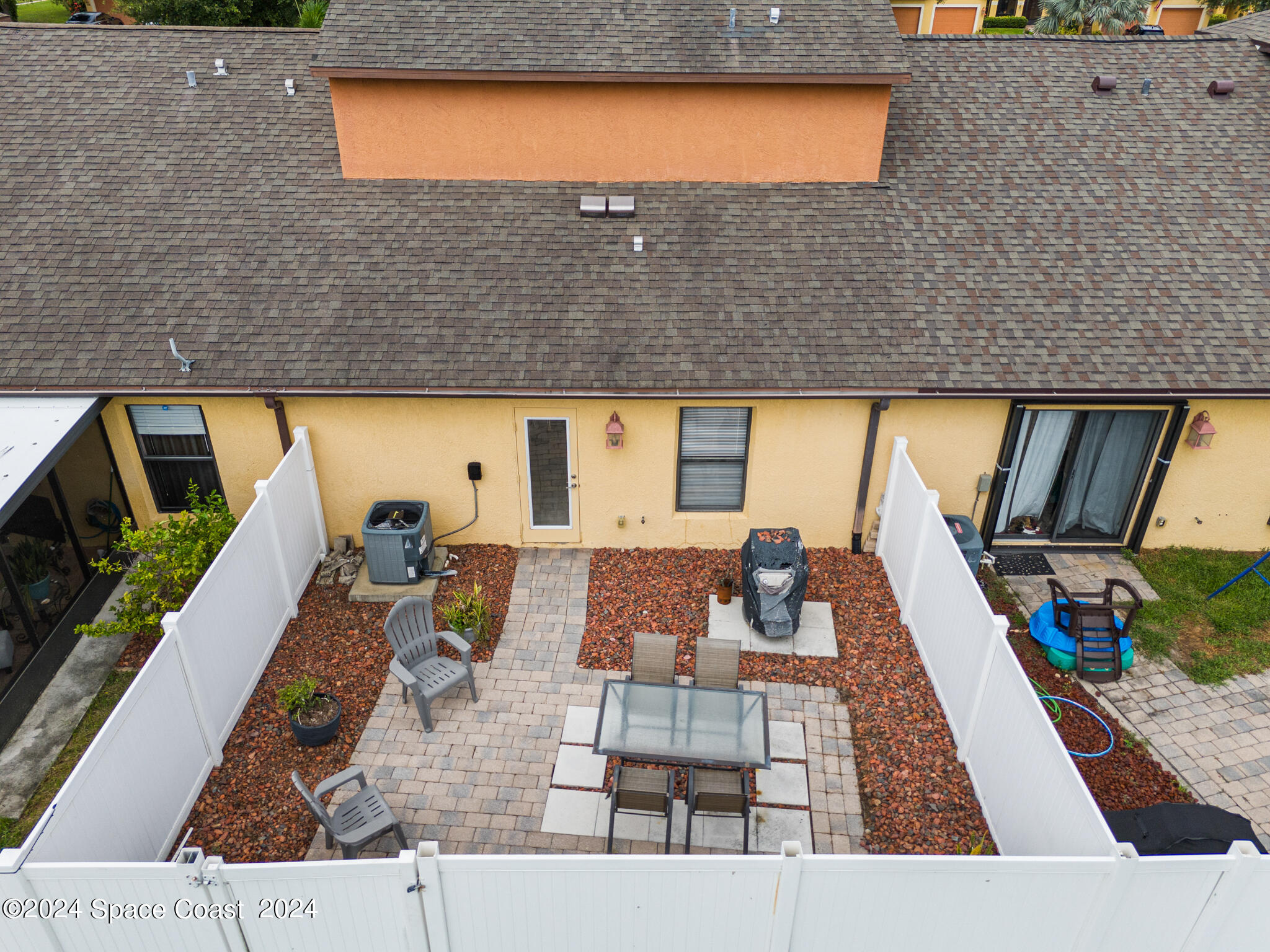 890 Luminary Circle, Unit 103 Melbourne, FL 32901 - Photo 22 of 32 swimming pool view with a couch and wooden floor