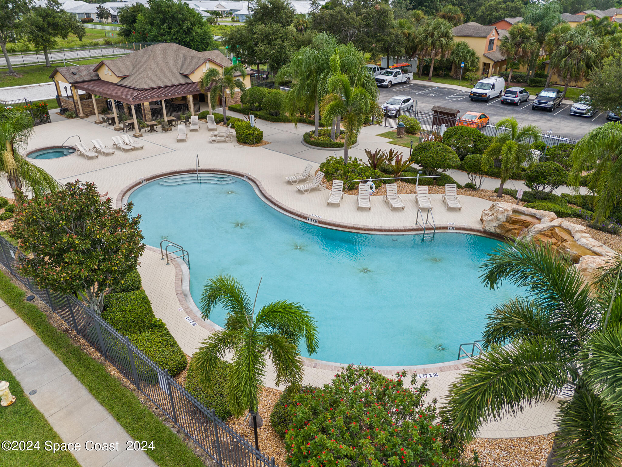 890 Luminary Circle, Unit 103 Melbourne, FL 32901 - Photo 23 of 32 swimming pool with outdoor seating and yard