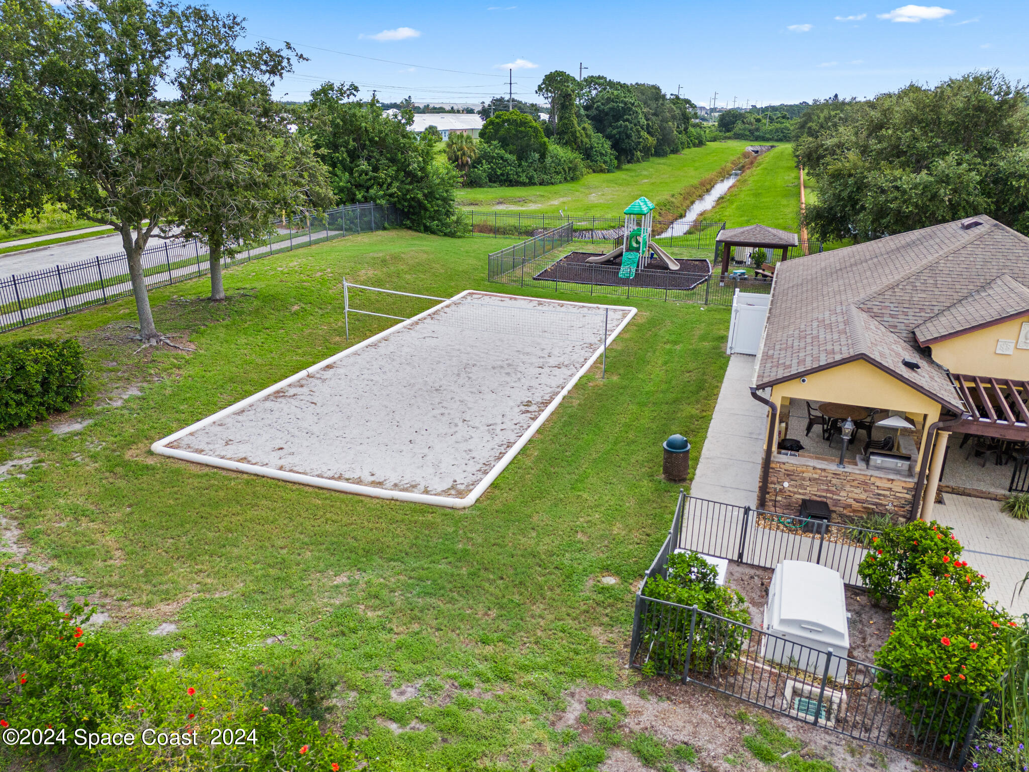 890 Luminary Circle, Unit 103 Melbourne, FL 32901 - Photo 25 of 32 an aerial view of a house with outdoor space patio and mountain view