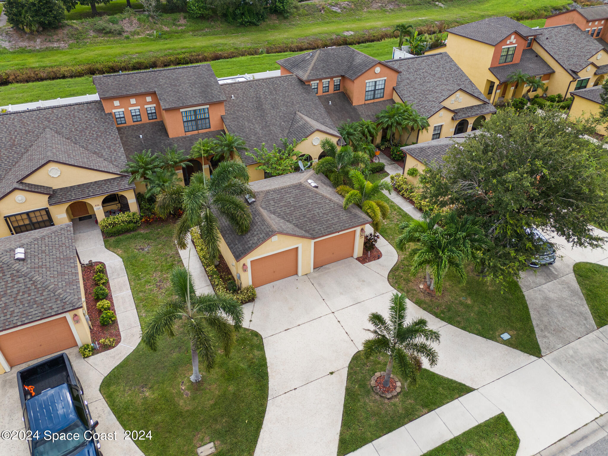890 Luminary Circle, Unit 103 Melbourne, FL 32901 - Photo 31 of 32 an aerial view of a house with garden space and street view