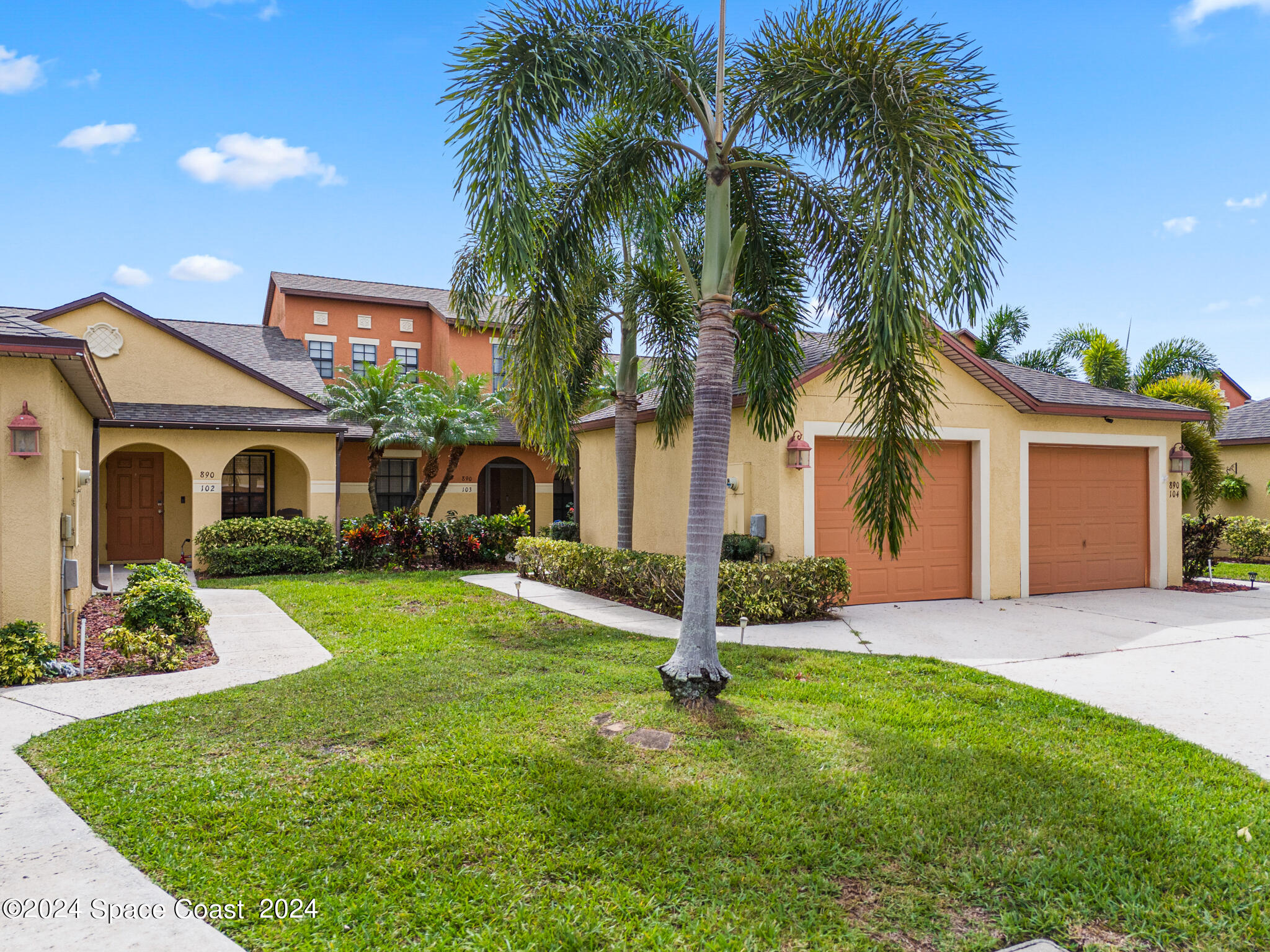 890 Luminary Circle, Unit 103 Melbourne, FL 32901 - Photo 32 of 32 a front view of house with yard and green space