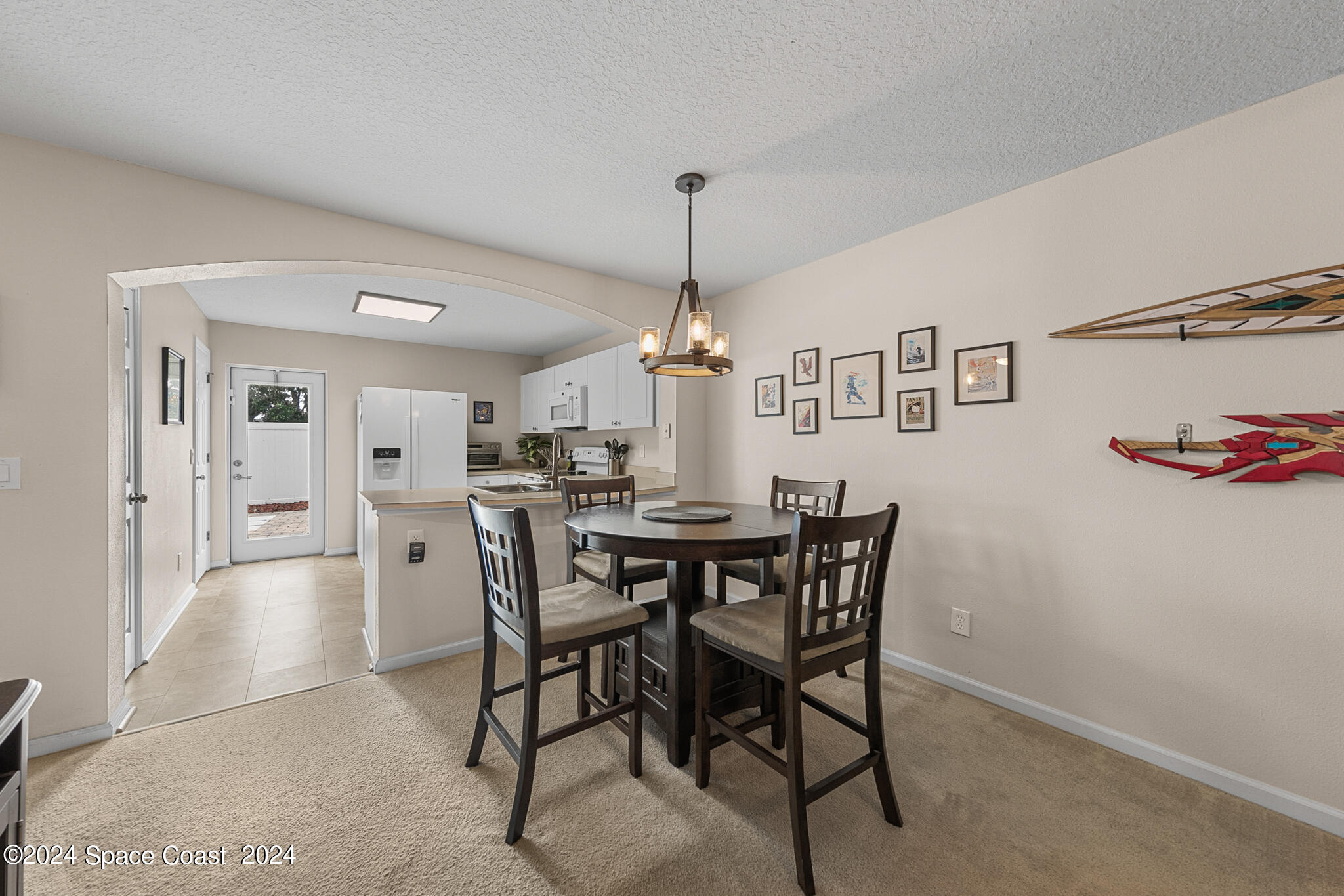 890 Luminary Circle, Unit 103 Melbourne, FL 32901 - Photo 10 of 32 a view of a dining room with furniture