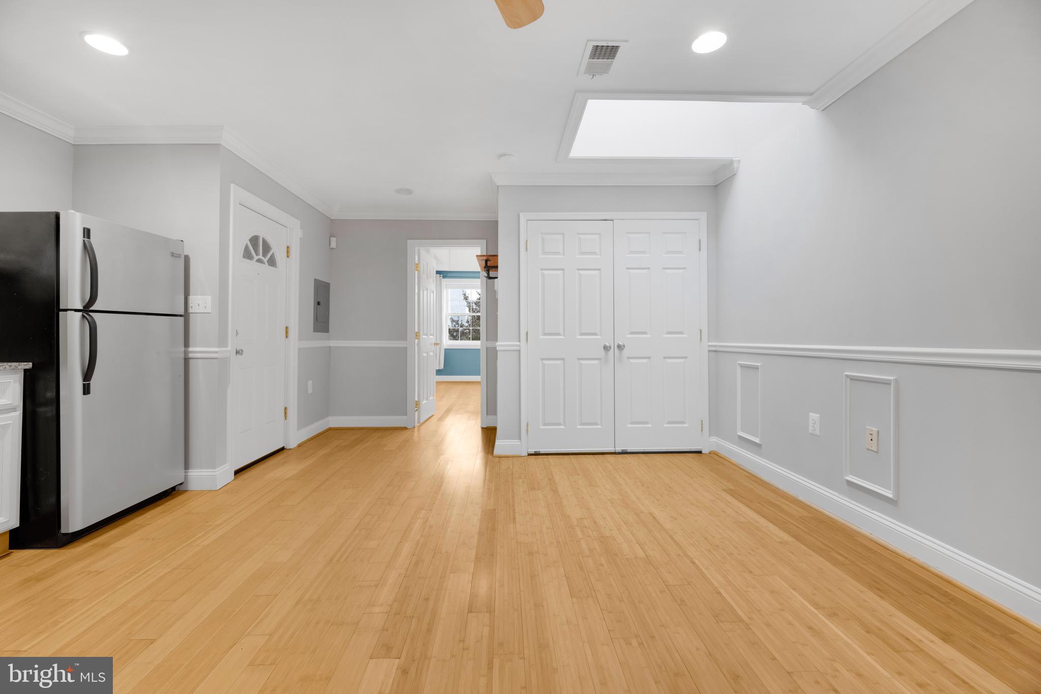 1917 Rosedale Street Northeast, Unit 3 Washington, DC 20002 - Photo 3 of 15 a view of empty room with wooden floor