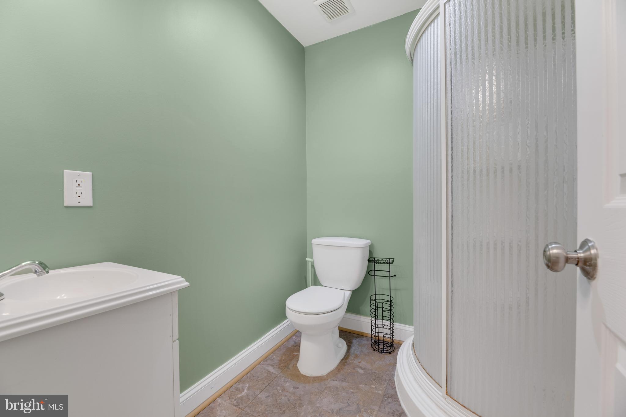 1917 Rosedale Street Northeast, Unit 3 Washington, DC 20002 - Photo 5 of 15 a bathroom with a toilet and a sink