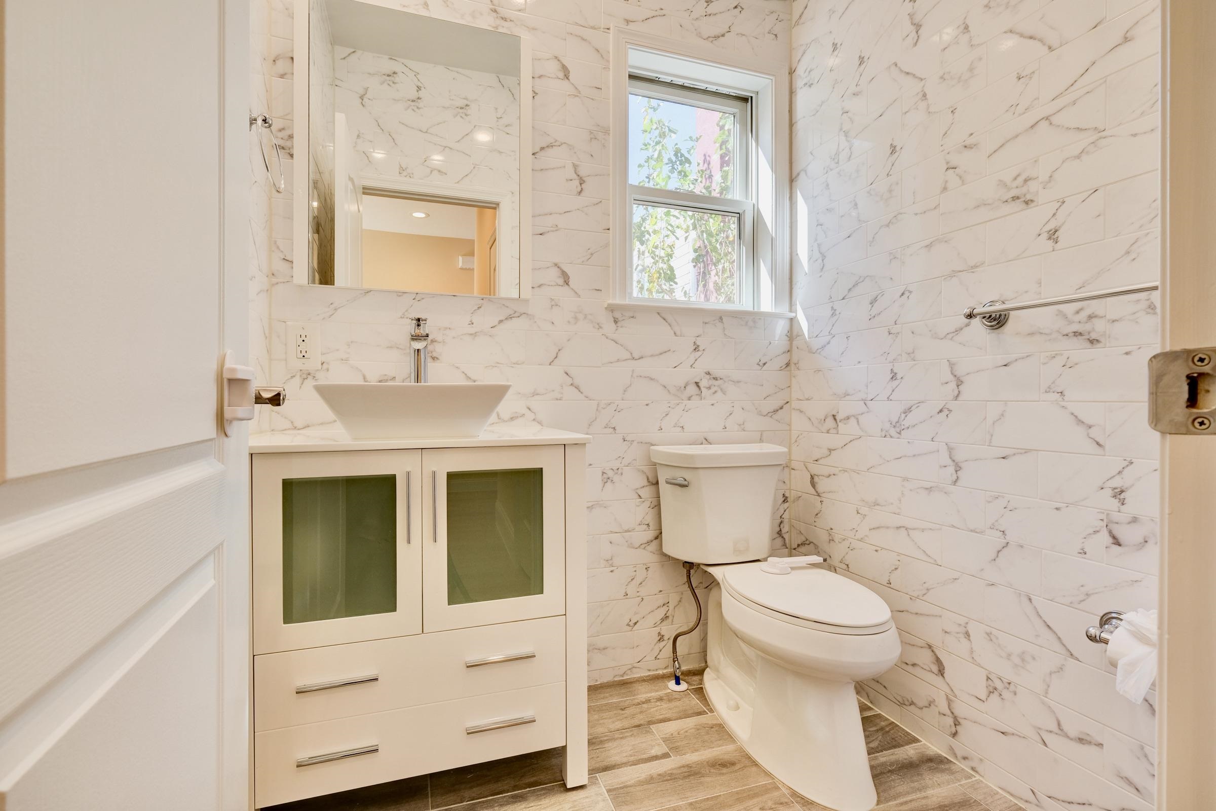 726 Chestnut Street, Unit B Secaucus, NJ 07094 - Photo 20 of 50 a bathroom with a toilet and a sink