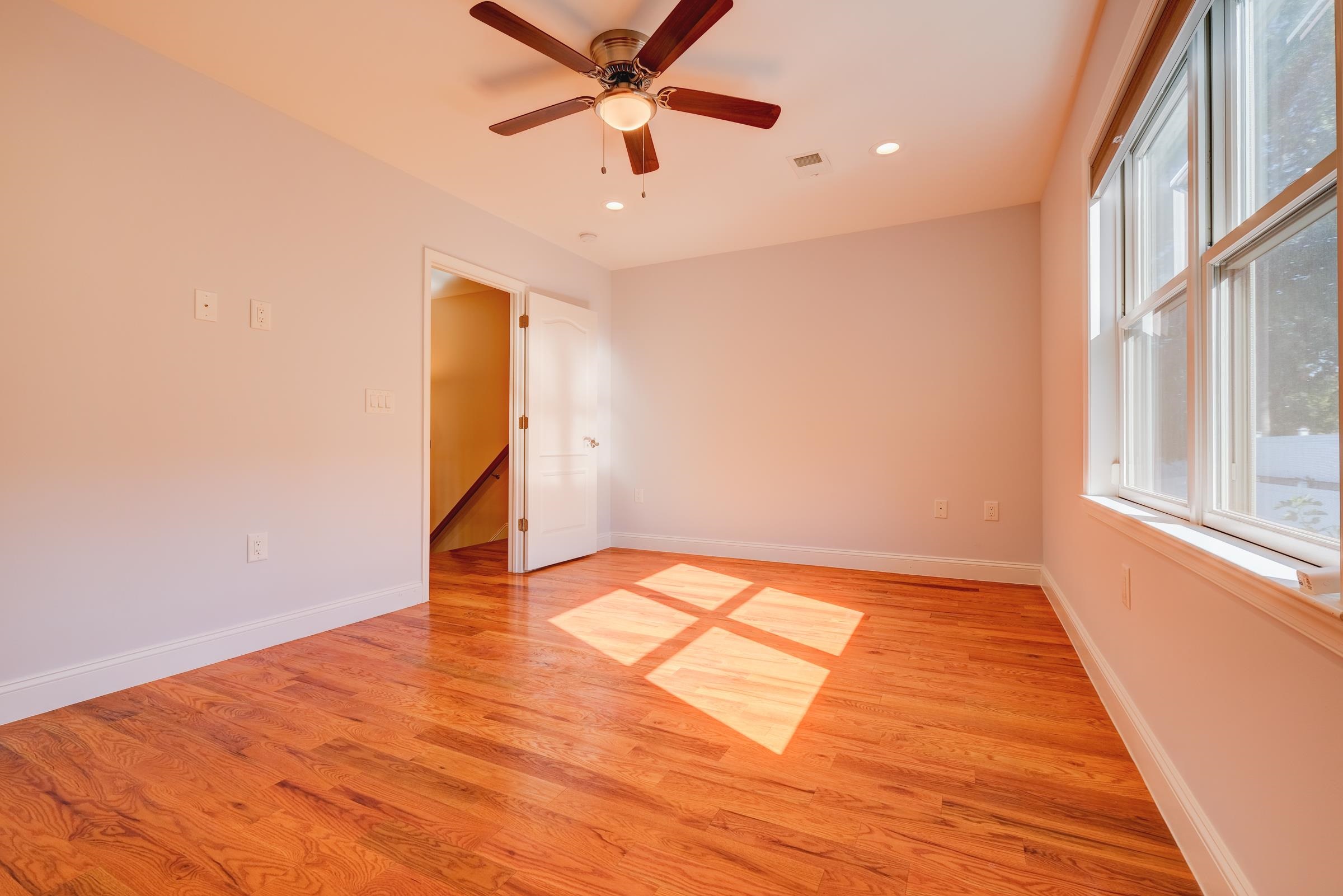 726 Chestnut Street, Unit B Secaucus, NJ 07094 - Photo 25 of 50 wooden floor in an empty room with a window