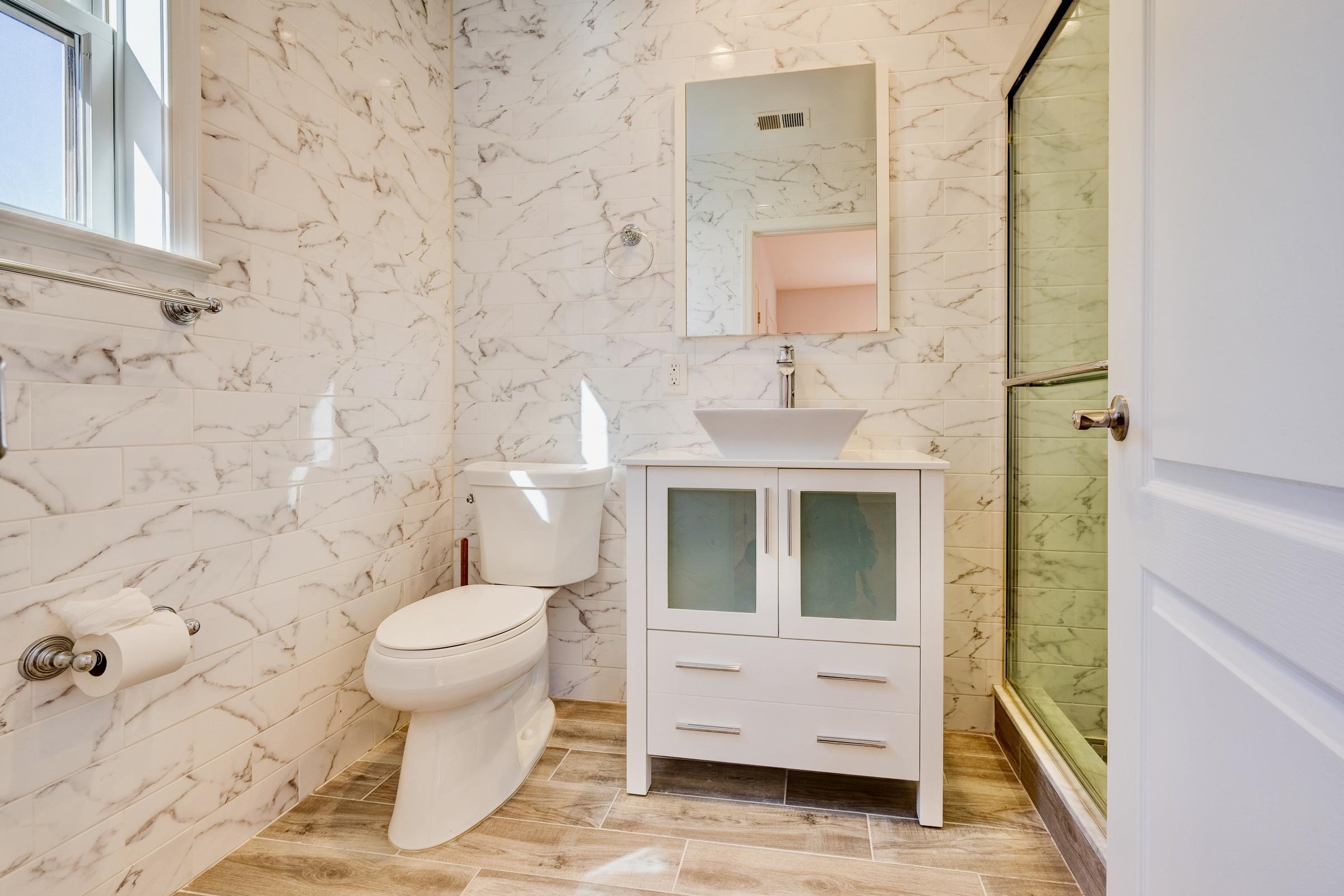 726 Chestnut Street, Unit B Secaucus, NJ 07094 - Photo 26 of 50 a bathroom with a sink and a toilet