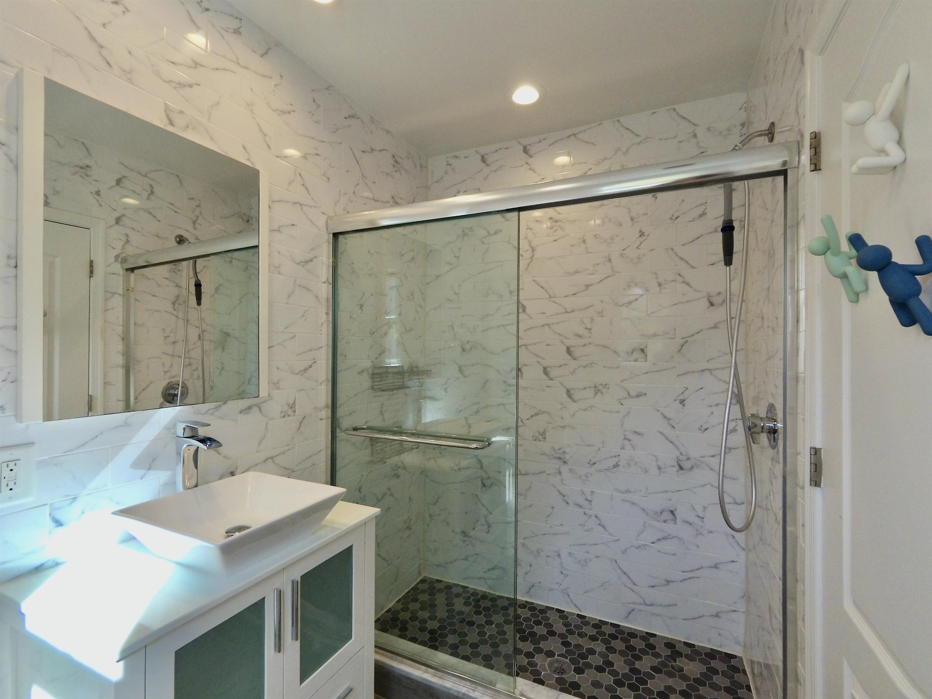 726 Chestnut Street, Unit B Secaucus, NJ 07094 - Photo 27 of 50 a bathroom with a sink shower and a mirror