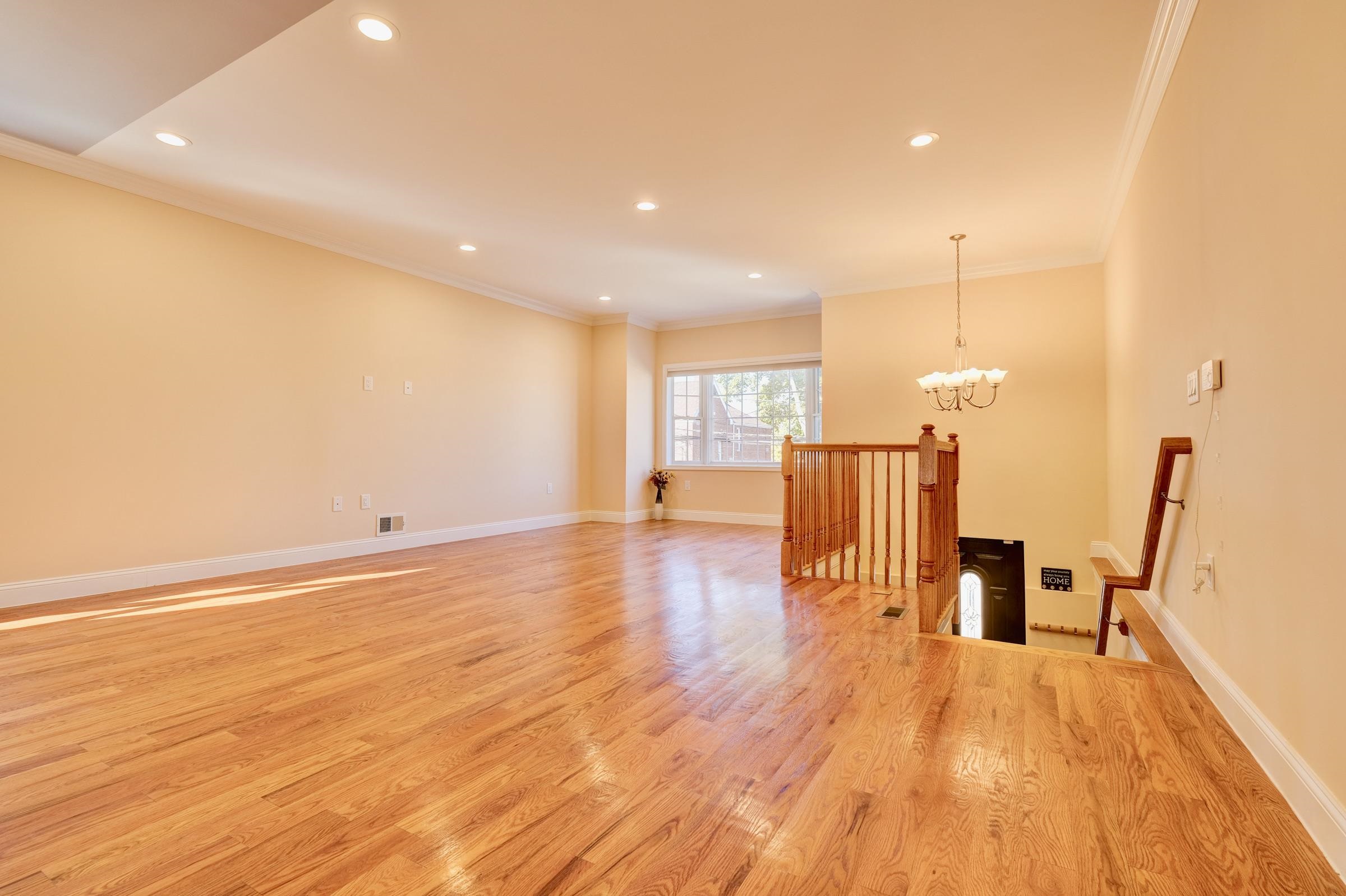 726 Chestnut Street, Unit B Secaucus, NJ 07094 - Photo 4 of 50 a view of a living room a stove and wooden floor