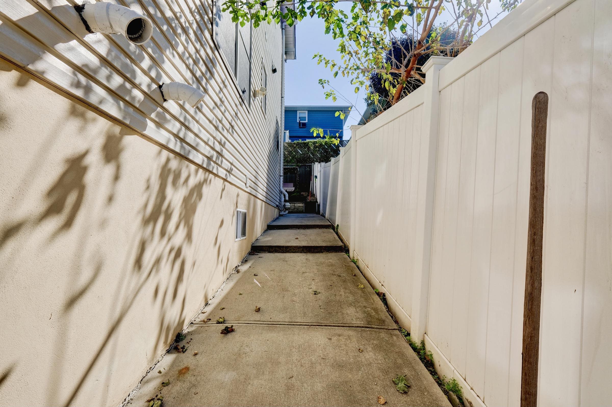 726 Chestnut Street, Unit B Secaucus, NJ 07094 - Photo 47 of 50 a view of a pathway of a building with wooden floor