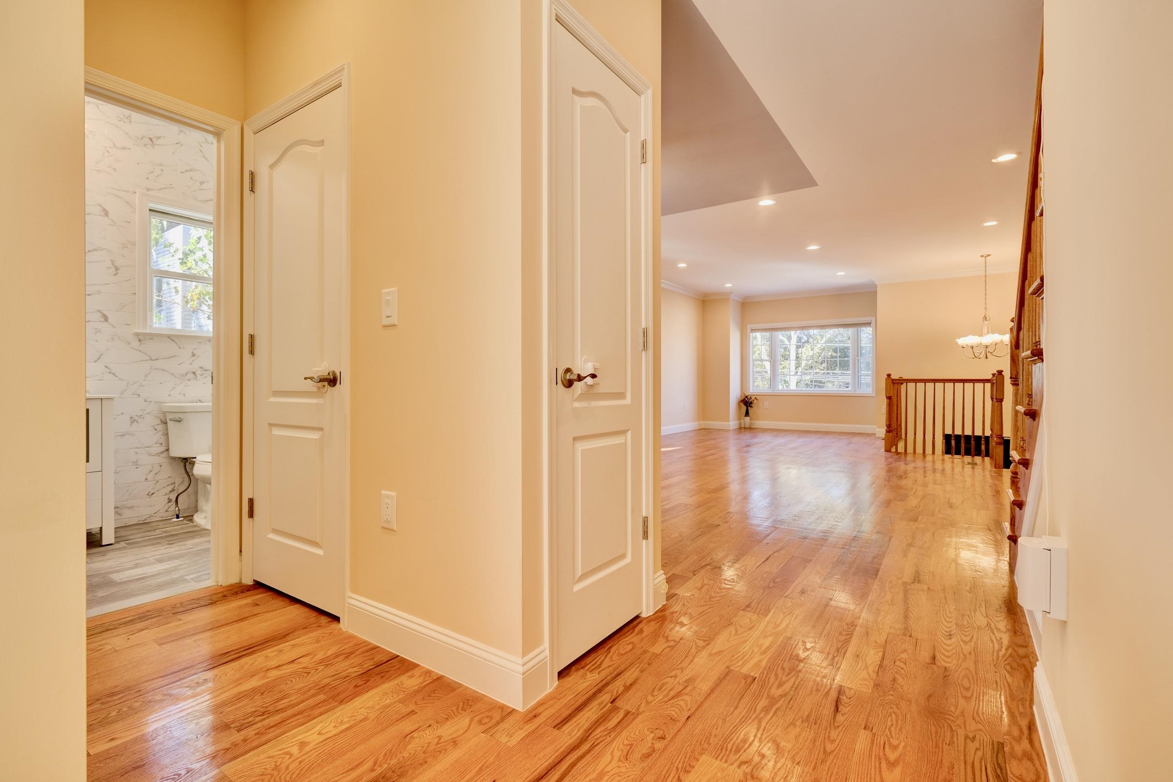 726 Chestnut Street, Unit B Secaucus, NJ 07094 - Photo 8 of 50 a view of a hallway with wooden floor windows and a living room