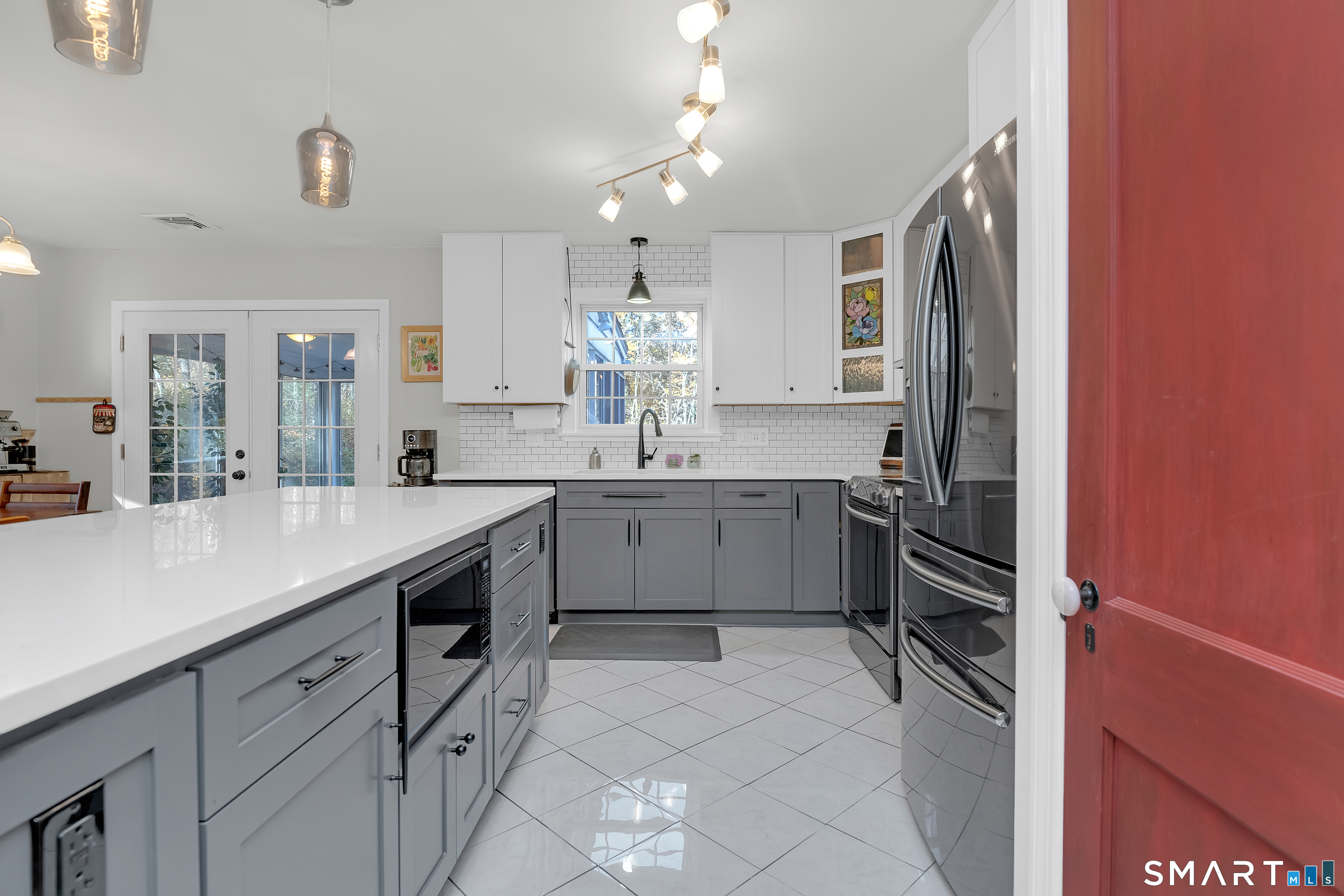 16 Marion Road Bethany, CT 06524 - Photo 7 of 40 a kitchen with a sink cabinets and stainless steel appliances