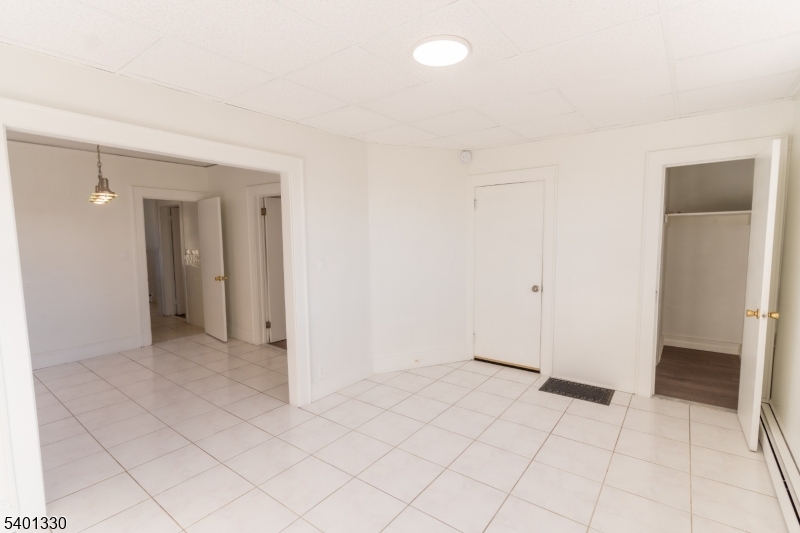 123 Clark Place Elizabeth Port, NJ 07206 - Photo 4 of 17 an empty room with a bathroom