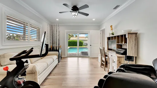 a view of a livingroom with furniture and a window