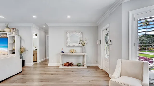a view of a living room and entry way