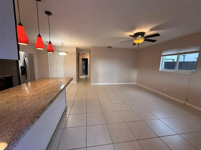 a very nice looking dining room with a open kitchen view