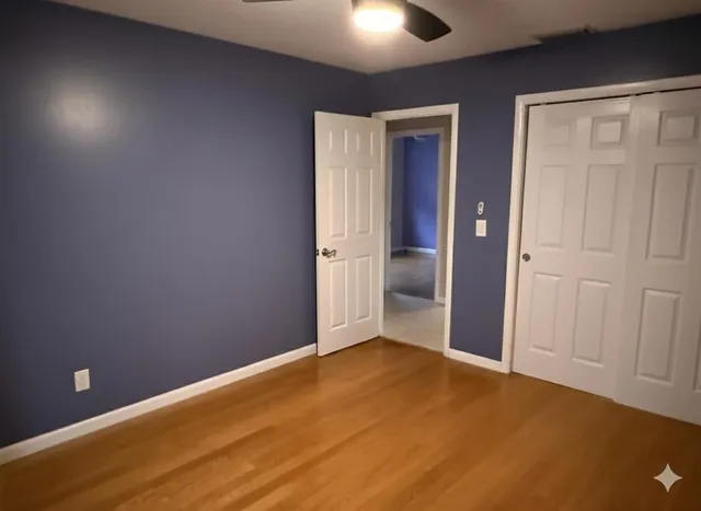 an empty room with closet area