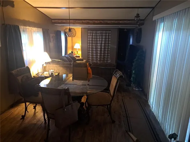 a view of a dining room with furniture and window