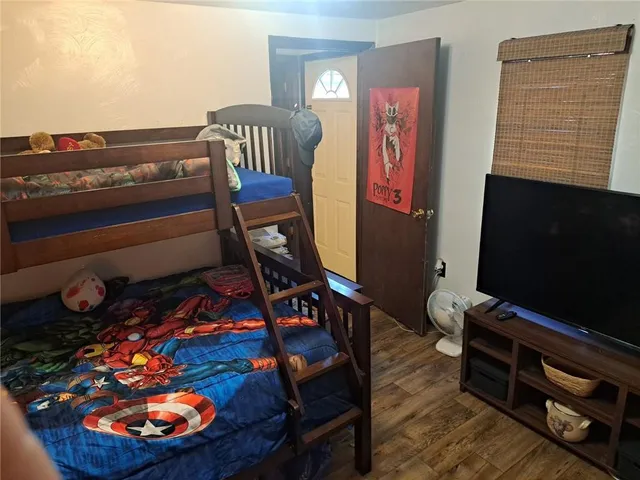 a room with furniture and wooden floor