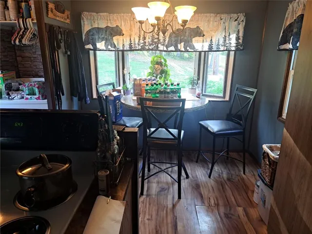 a view of a dining room with furniture window and outside view